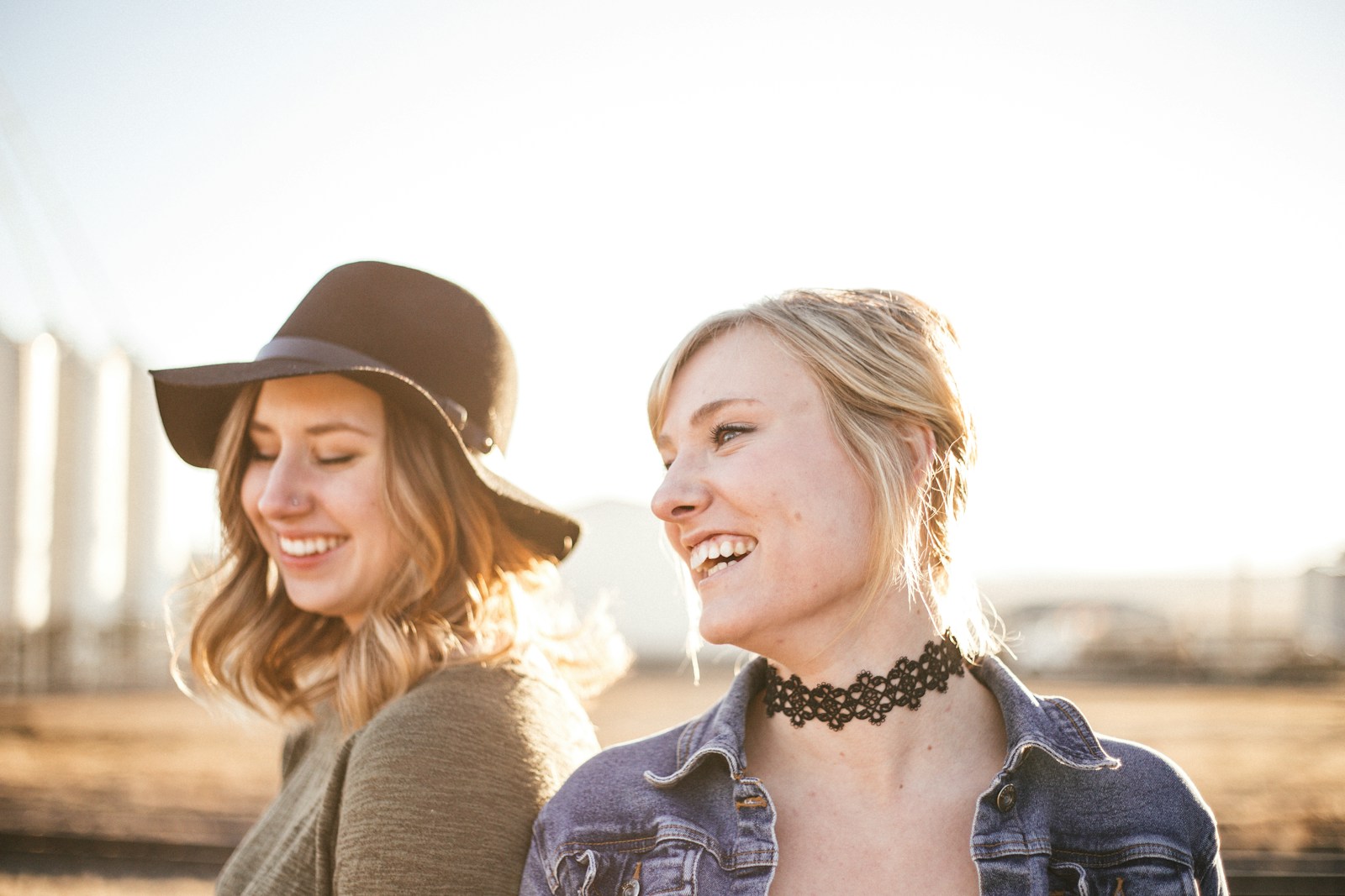 two woman taking a sideview selfie