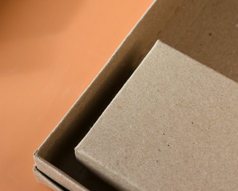 an open cardboard box sitting on top of a table