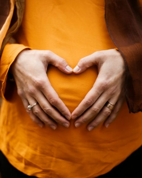 person touching stomach