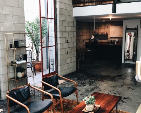 brown wooden table near green potted plant
