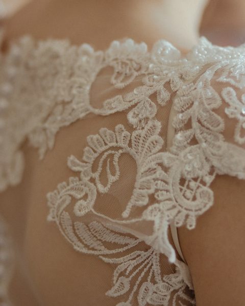 woman wearing white sheer lace wedding gown