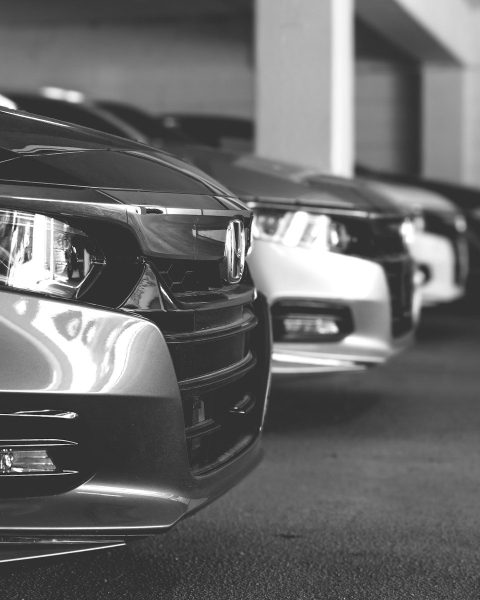grayscale photo of car on road